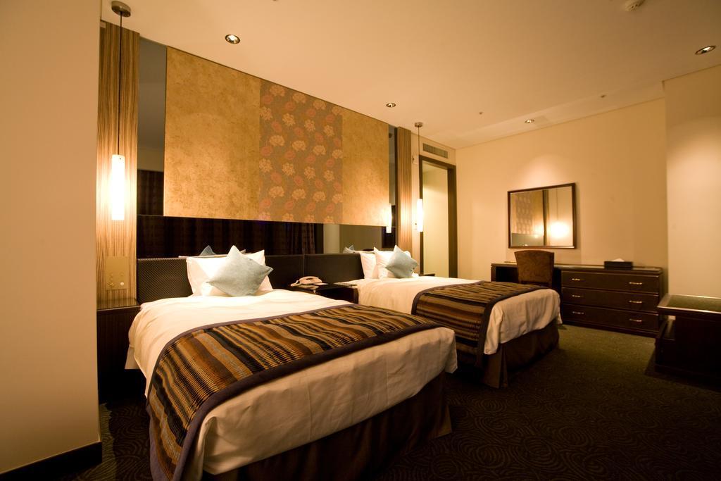Okinawa Kariyushi Urban Resort Naha Værelse billede